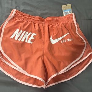 Orange Nike shorts
